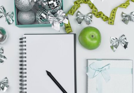 Lose weight for the new year, Christmas balls, shape, Apple and ribbon. Diet concept. flat Ley. copy space. Mock upの写真素材
