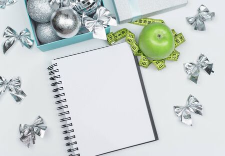 Lose weight for the new year, Christmas balls, shape, Apple and ribbon. Diet concept. flat Ley. copy space. Mock upの写真素材