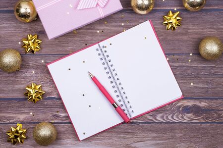 Christmas checklist, letter to Santa, your invitation or advent activities on wooden background. Top view. Flat lay. copy spaceの写真素材