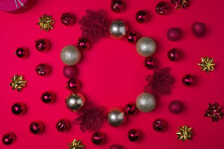 Red and gold Christmas balls on red background, top view , copy spaceの写真素材
