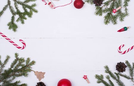 Spruce branches, Christmas balls, candy on a white background, preparing for the New year and Christmas, top view Flat layの写真素材