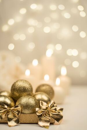 golden christmas ball on golden star bokeh background, New Year and Christmas decorationの写真素材