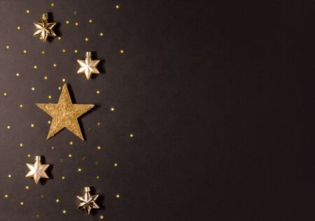 Gold star on a black backgroundの写真素材