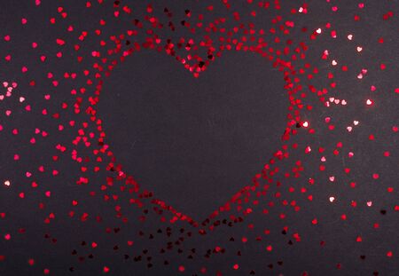 Valentine's day red bokeh glitter on black background,の写真素材