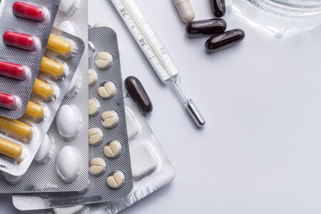 A bunch of blister packs of tablets, pills coronavirus the spring epidemic. flu and cold medications. Close up, macroの写真素材
