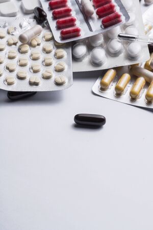 A bunch of blister packs of tablets, one pills of coronavirus. flu and cold medications. Copy space, Close up, macroの写真素材
