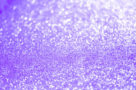 Sparkling bokeh background in a fresh purple color. sequins purple flares background defocusの写真素材
