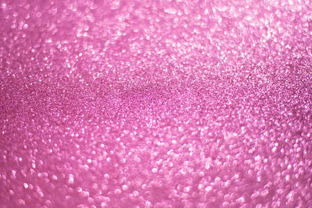 Sparkling bokeh background in a fresh pink color. pink sequins background defocusの写真素材
