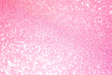 Sparkling bokeh background in a fresh pink color. pink sequins background defocusの写真素材