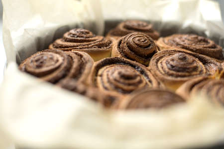 Baked rolls with cinnabar, cinnamon rolls in a round shape. Flavorful pastriesの写真素材