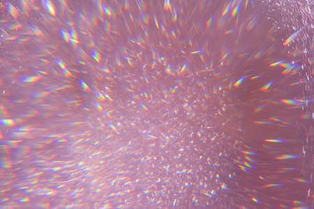 Defocused pink sequins,flares highlights sparkling carpet. Close-up, very shallow depth of field . Macro.の写真素材