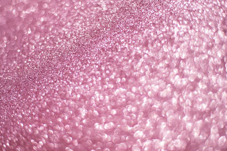 Sparkling bokeh background in a fresh pink color. pink sequins background defocusの写真素材