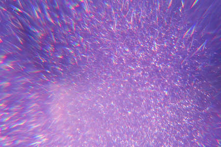Sparkling bokeh background in a fresh purple color. sequins purple flares background defocusの写真素材