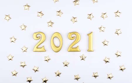 Happy New Year 2021. Sparkling numbers Year 2021 isolated on white background. golden overlay object for design holiday greeting card.の写真素材