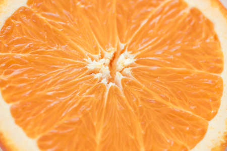 cut half of a fresh juicy textured orange, macro backgroundの写真素材