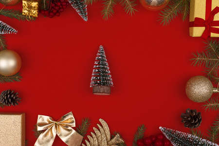 Frame of Christmas decorations on a red backgroundの写真素材