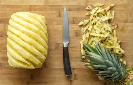 Ripe perfectly peeled pineapple, on a wooden background,の写真素材