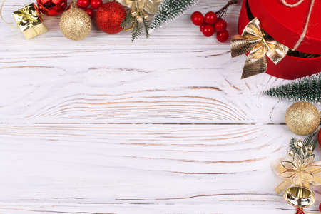 Christmas white wooden background with red gift box. top view. Holiday Greeting Cards Design. Copy Spaceの写真素材
