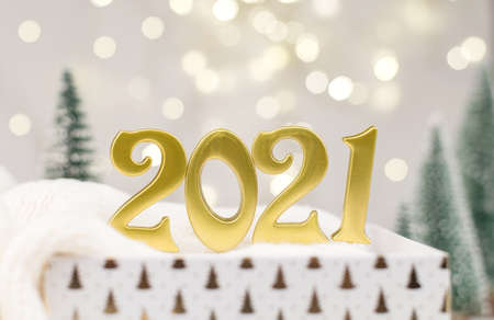 Year 2021 numbers on Golden bokeh background New year mood, Christmas, greeting card, new year backgroundの写真素材