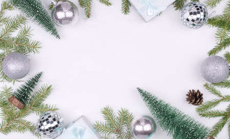 Frame of Christmas decorations on a white background,tree branches, cones, gifts Flatlay, CopySpace, New year 2021の写真素材