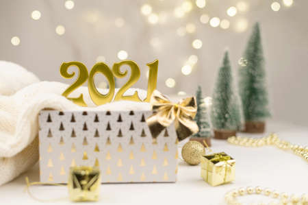 Numbers 2021 on Golden bokeh background New year mood, Christmas, greeting card, new year background.の写真素材