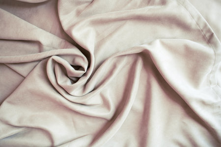 Beige velour pleats. Soft blackout curtains for the room. Fabric for tailoring.の写真素材