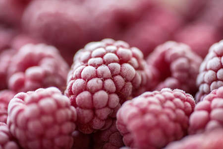 Ripe frozen raspberries close-up macro photography, selective focus, fruit backgroundの写真素材