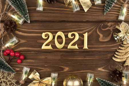 new year 2021 Golden numbers on wooden background with new year decor, Happy Christmas backgroundの写真素材