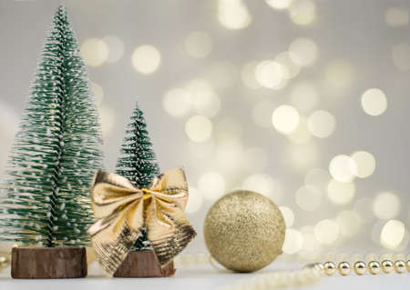 Two decorative Christmas trees and gifts for the new year on the bokeh background, Happy new year 2021の写真素材
