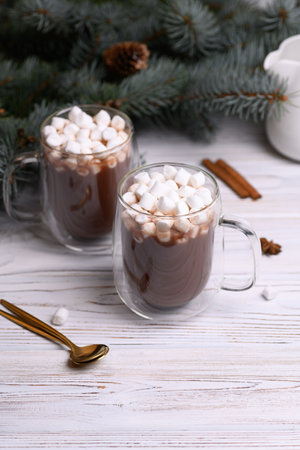Glass cup of brown cocoa with marshmeloy christmas tree, winter hot drinkの写真素材