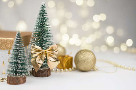 Christmas attributes, Christmas tree decor, gifts on the background of Golden bokeh, New year 2021.の写真素材
