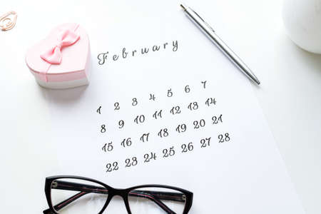 14 February calendar with pink gift box heart on top Valentine's Day card.の写真素材