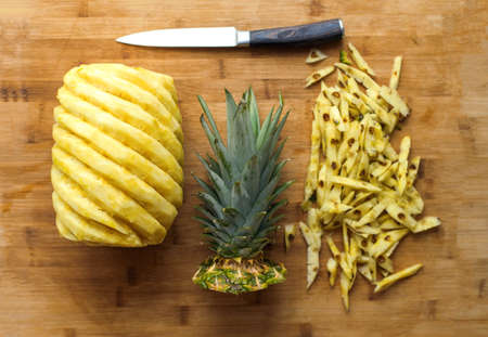 Ripe perfectly peeled pineapple, on a wooden background,の写真素材