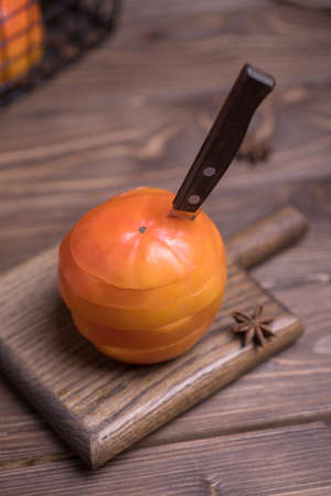 Fresh ripe, orange under persimmons cut into slices, close-up.の写真素材