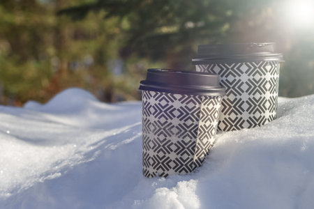 Two Takeaway Coffee Cup on the winter backgroundの写真素材