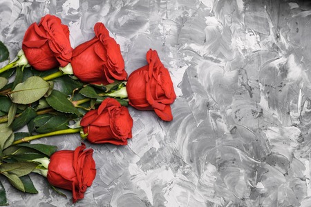 Red roses. Romantic background. Mother's, Valentines, Women's, Wedding Day. Top view with copy space. Place for text. Floral ornament, pattern, design, frame.の写真素材