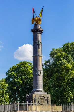 POLTAVA, UKRAINE - May 15, 2018: Monument of Glory with the fixed State Flag of Ukraine and the flag of the Organization of Ukrainian Nationalistsのeditorial素材