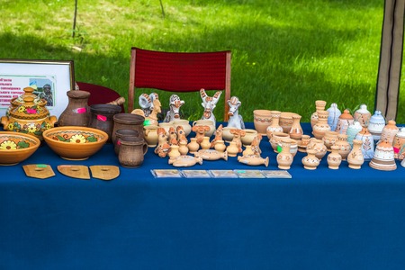 OPPOSHNYA, UKRAINE - May 14, 2018: Counter with pottery: dishes and statuettesのeditorial素材