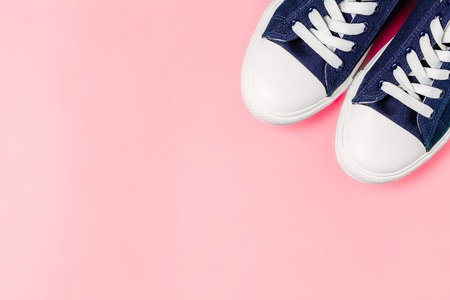 New sneakers on a pink background. View from above. Copy the spaceの写真素材