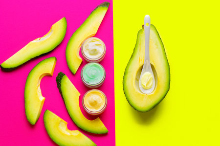 Avocado cream in pot with fruit. Cosmetics from natural ingredients natural concept.