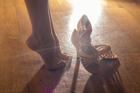 Female legs and shoes for ballroom dancing close-ups. Preparations for the performance, for the dance conceptの写真素材