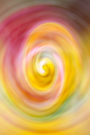 Bright multicolor abstract background. Blurred pink, yellow, green spiral waveの写真素材