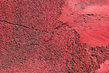 Old crumbling red stucco grunge texture background. Copy space.の写真素材