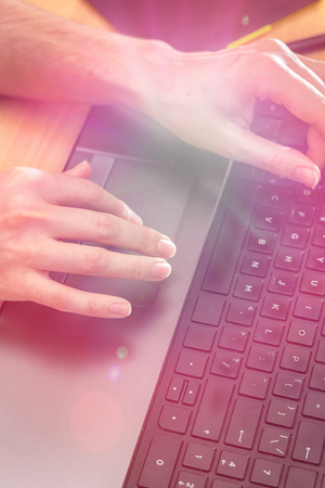 Closeup image of hand using and touching on laptop.の写真素材