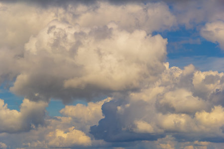 Light cumulus clouds in the blue sky.