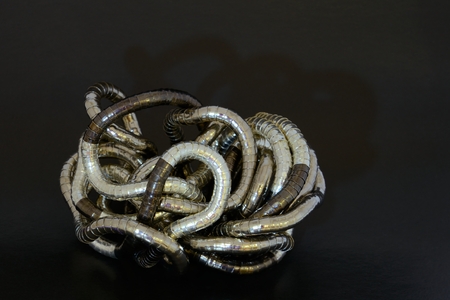 jewelry decoration curled metal on black backgroundの写真素材