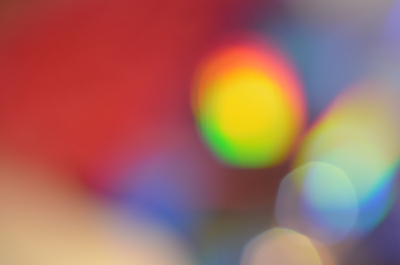 Natural abstract colorful bokeh background received from the light of lamp on CD disk with glitter, defocusedの写真素材