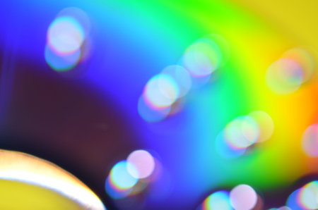 Natural abstract colorful bokeh background received from the light of lamp on CD disk with glitter,...