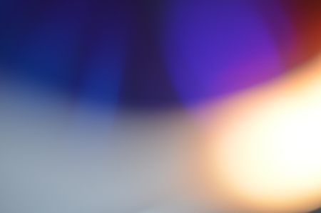 Natural abstract colorful bokeh background received from the light of lamp on CD disk with glitter, defocusedの写真素材