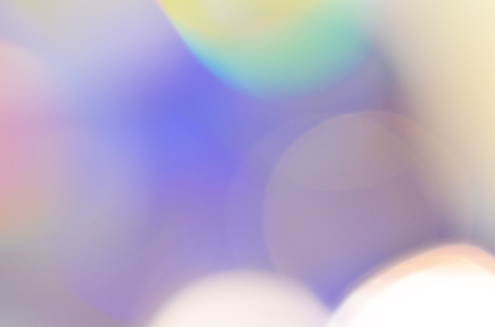 Natural abstract colorful bokeh background received from the light of lamp on CD disk with glitter, defocusedの写真素材